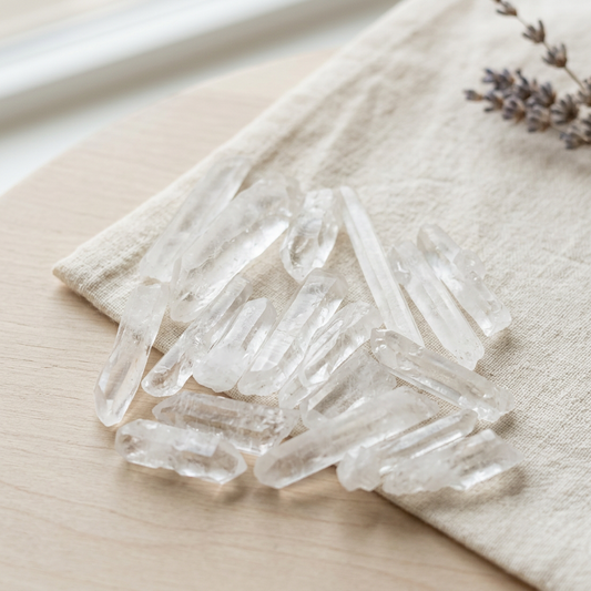 Crystal points styled on ivory linen with soft natural daylight